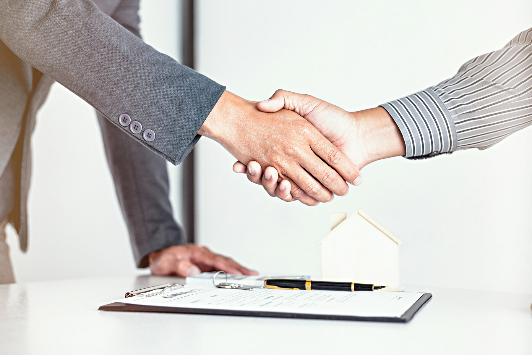 Broker and client closing a deal